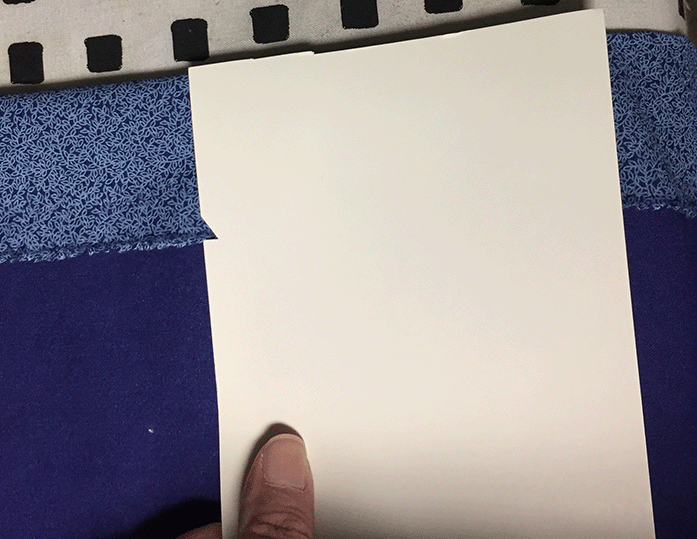 Using a card to measure the hem of the 30-minute peasant skirt